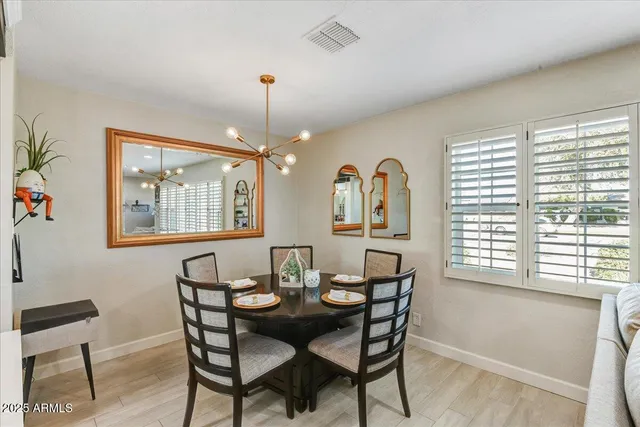 a view of a dining room with furniture and window