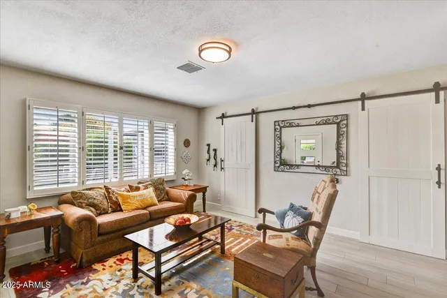 a living room with furniture and a window