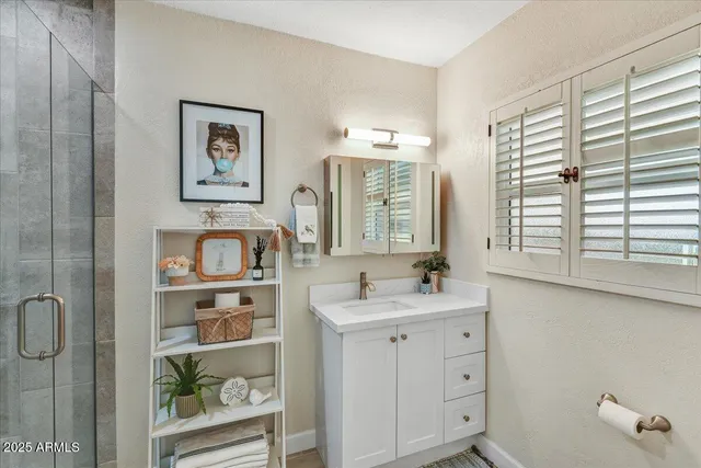 a bathroom with a sink and a window