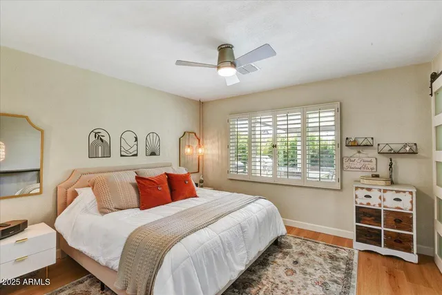 a bedroom with a large bed and a window