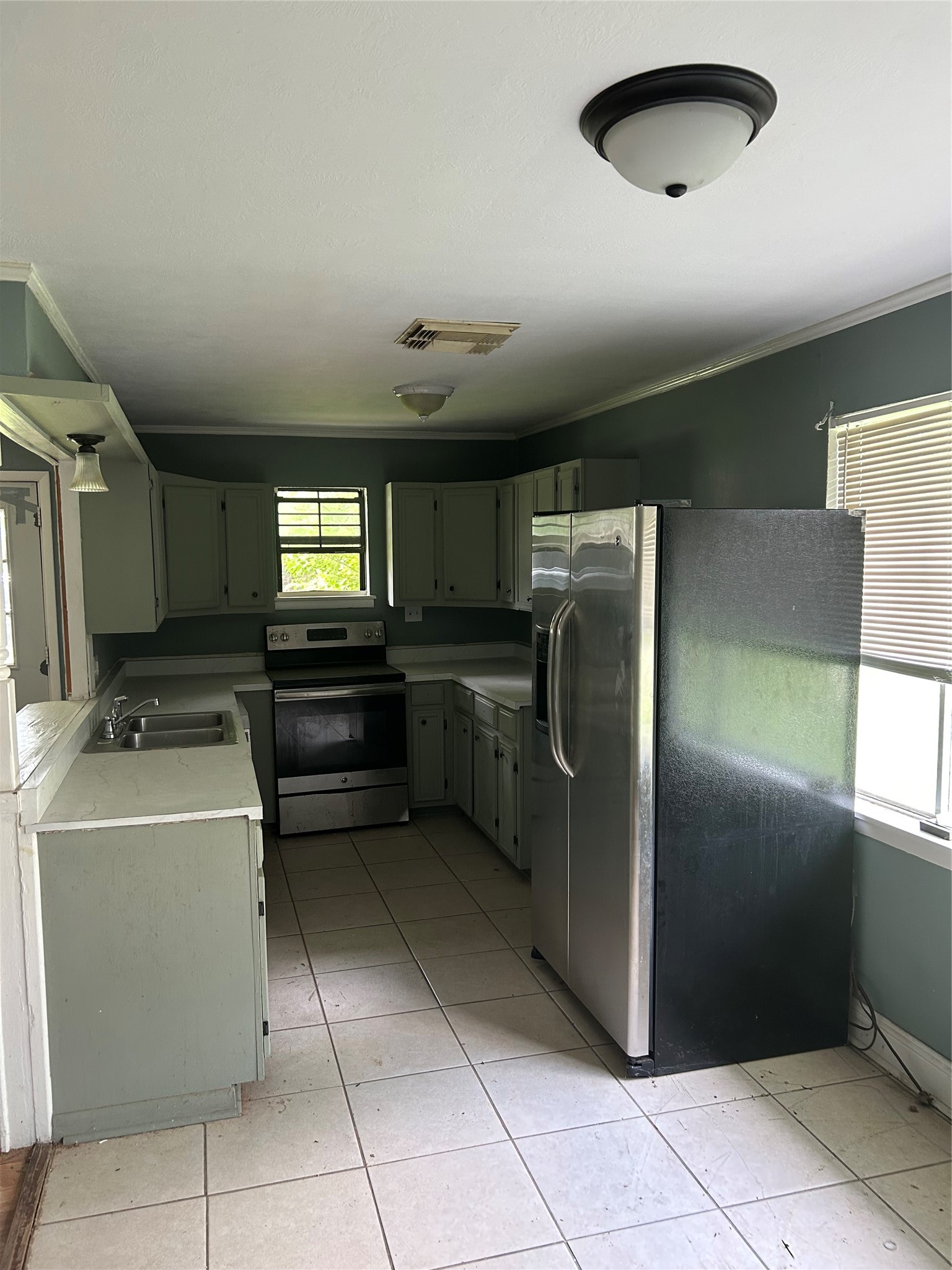 3040 Nineteenth Street Beaumont, TX 77706 - Photo 13 of 14 a kitchen with a refrigerator and a sink