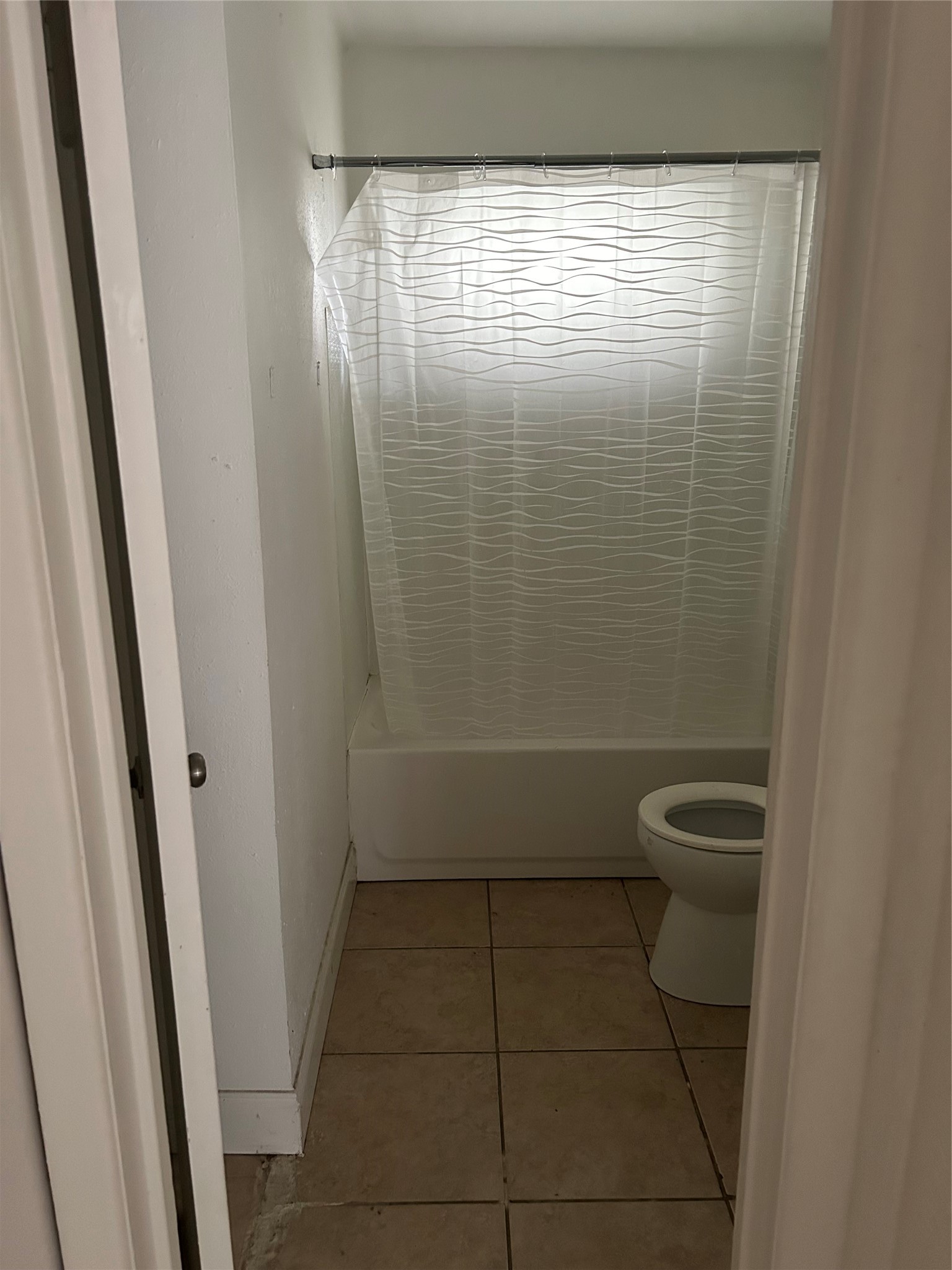 3040 Nineteenth Street Beaumont, TX 77706 - Photo 14 of 14 a bathroom with a granite countertop sink a toilet a shower and a mirror