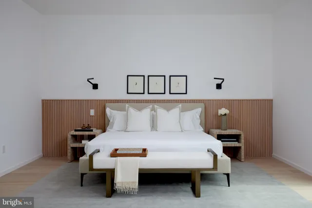 a view of a swimming pool with a bench and floor to ceiling window