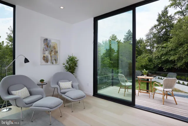 a view of a hallway with paintings on the wall