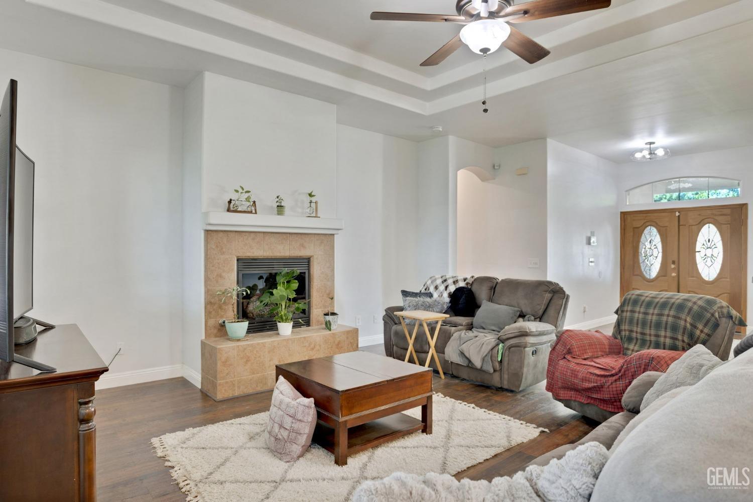 Undisclosed Address Bakersfield, CA 93314 - Photo 11 of 36 a living room with furniture a window and a chandelier