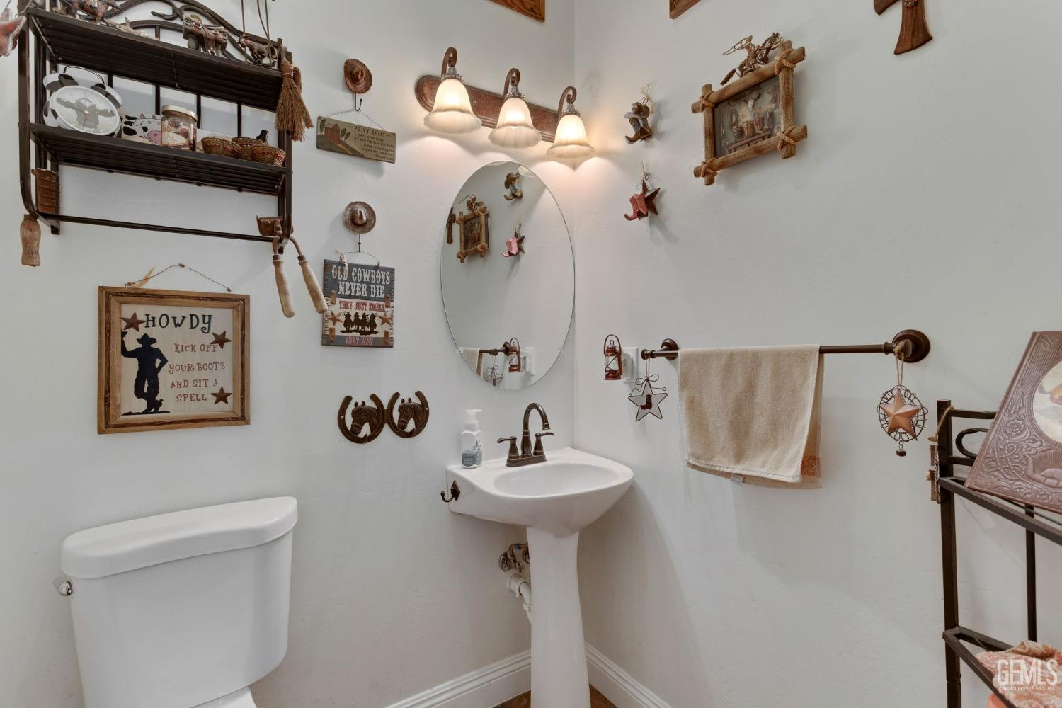 Undisclosed Address Bakersfield, CA 93314 - Photo 12 of 36 a bathroom with a sink mirror and toilet