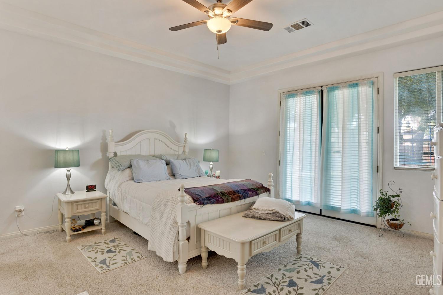 Undisclosed Address Bakersfield, CA 93314 - Photo 15 of 36 a bedroom with bed and a chandelier