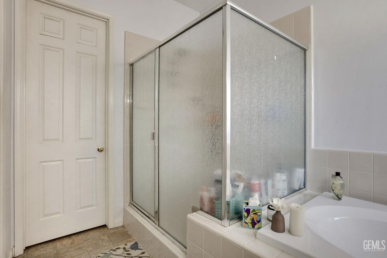 Undisclosed Address Bakersfield, CA 93314 - Photo 17 of 36 a bathroom with a sink and a tub