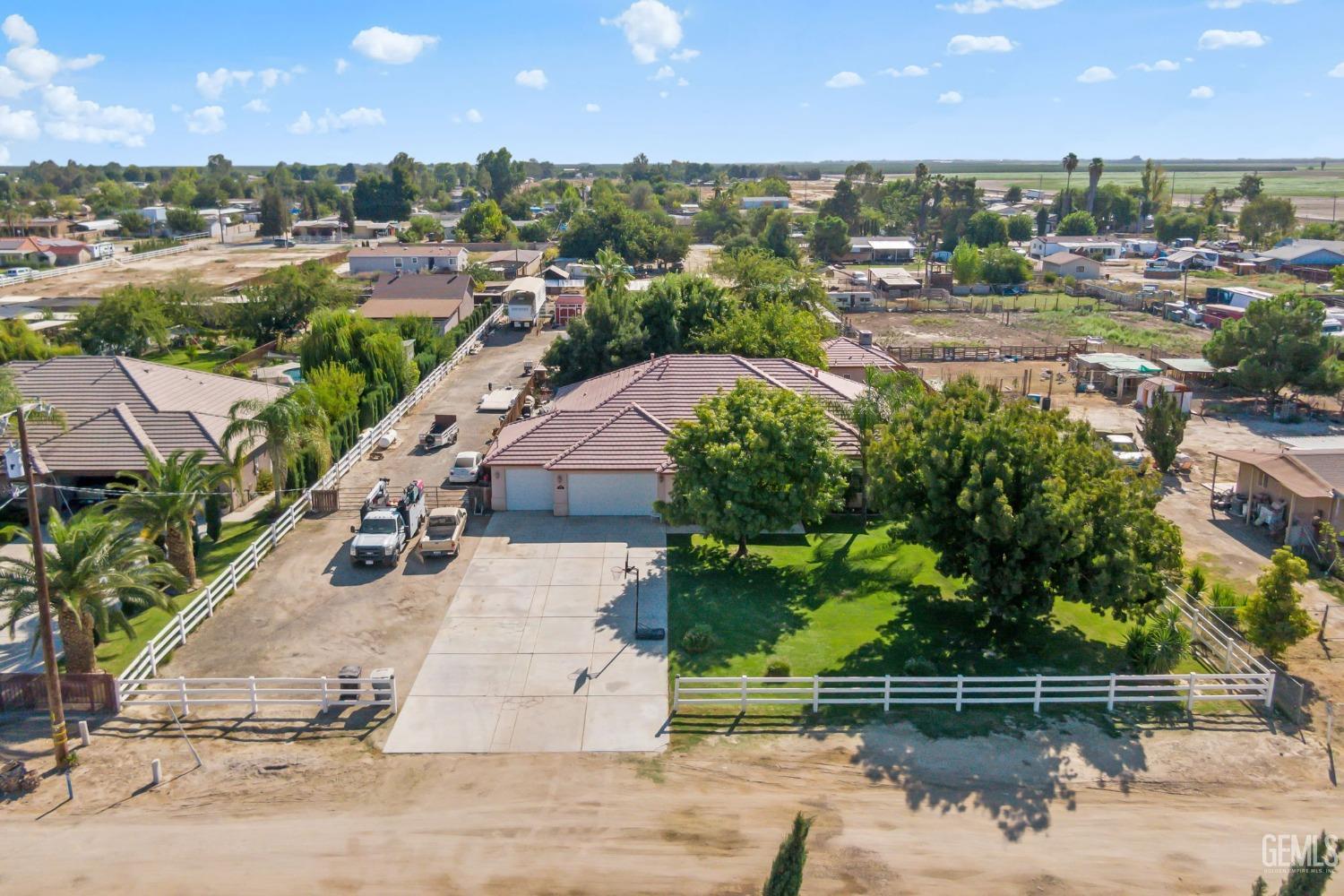Undisclosed Address Bakersfield, CA 93314 - Photo 2 of 36 an aerial view of a house with a yard