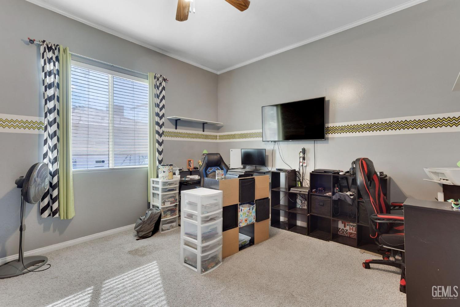 Undisclosed Address Bakersfield, CA 93314 - Photo 22 of 36 a view of a livingroom with workspace and a window