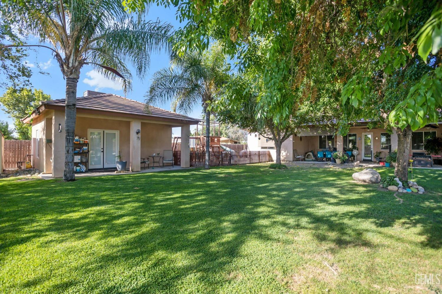 Undisclosed Address Bakersfield, CA 93314 - Photo 23 of 36 a view of a house with a yard