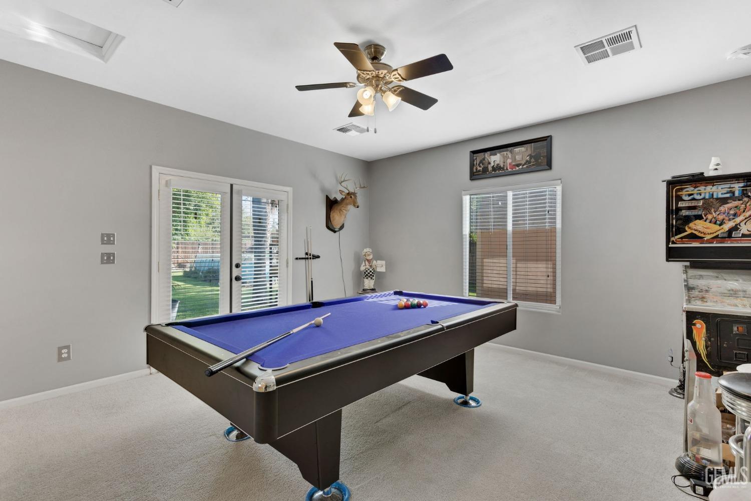 Undisclosed Address Bakersfield, CA 93314 - Photo 24 of 36 a room with pool table and windows