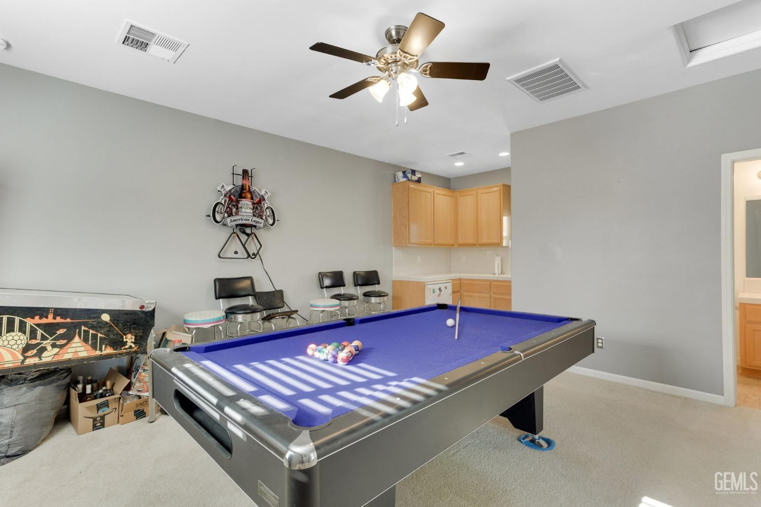 Undisclosed Address Bakersfield, CA 93314 - Photo 25 of 36 a room with gym equipment and a chandelier