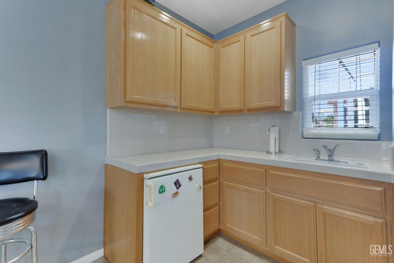 Undisclosed Address Bakersfield, CA 93314 - Photo 26 of 36 a kitchen with a sink cabinets and a window