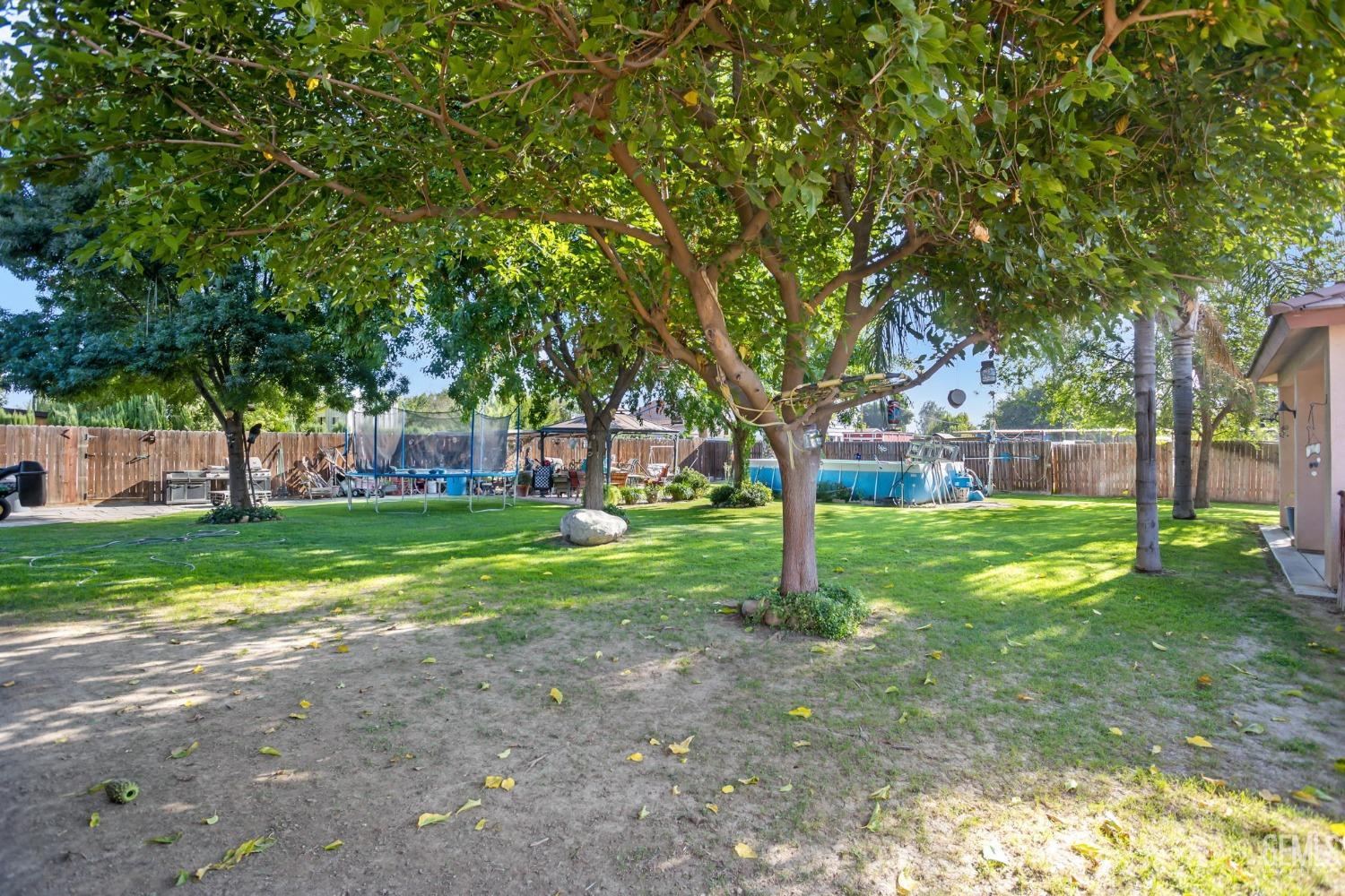 Undisclosed Address Bakersfield, CA 93314 - Photo 28 of 36 a view of a house with a yard