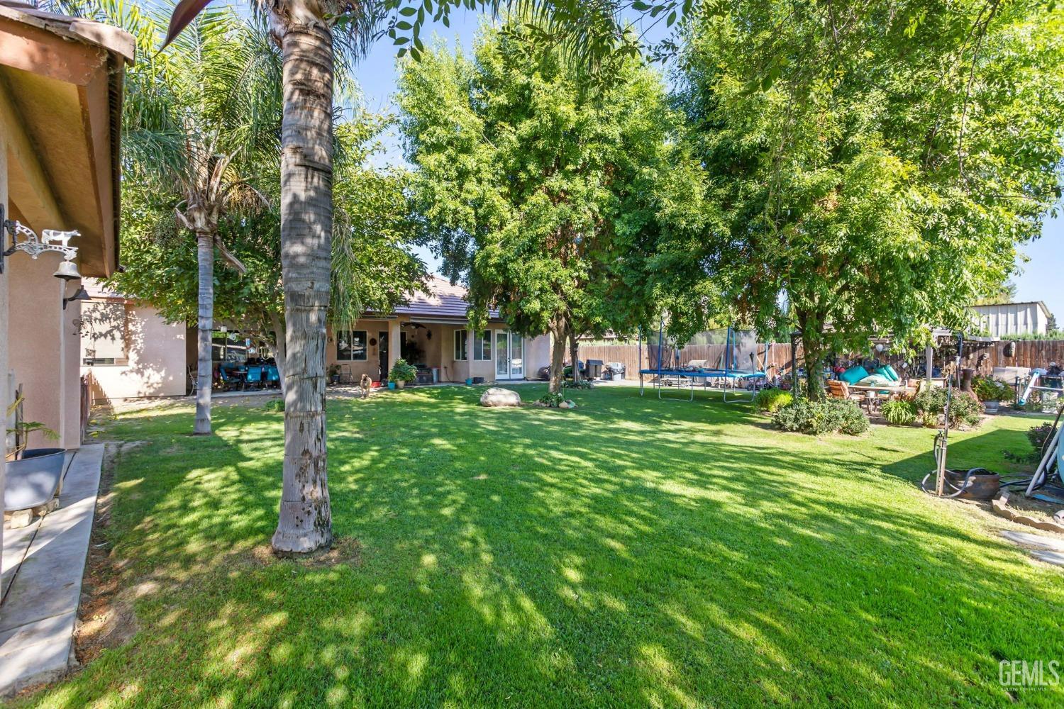 Undisclosed Address Bakersfield, CA 93314 - Photo 29 of 36 a view of a house with a backyard
