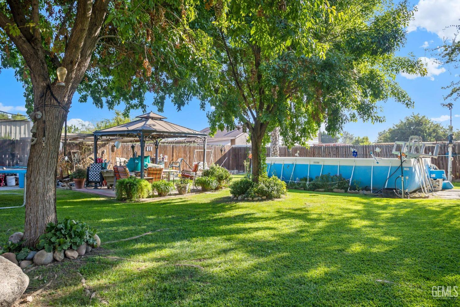 Undisclosed Address Bakersfield, CA 93314 - Photo 30 of 36 a view of a house with a yard and sitting area