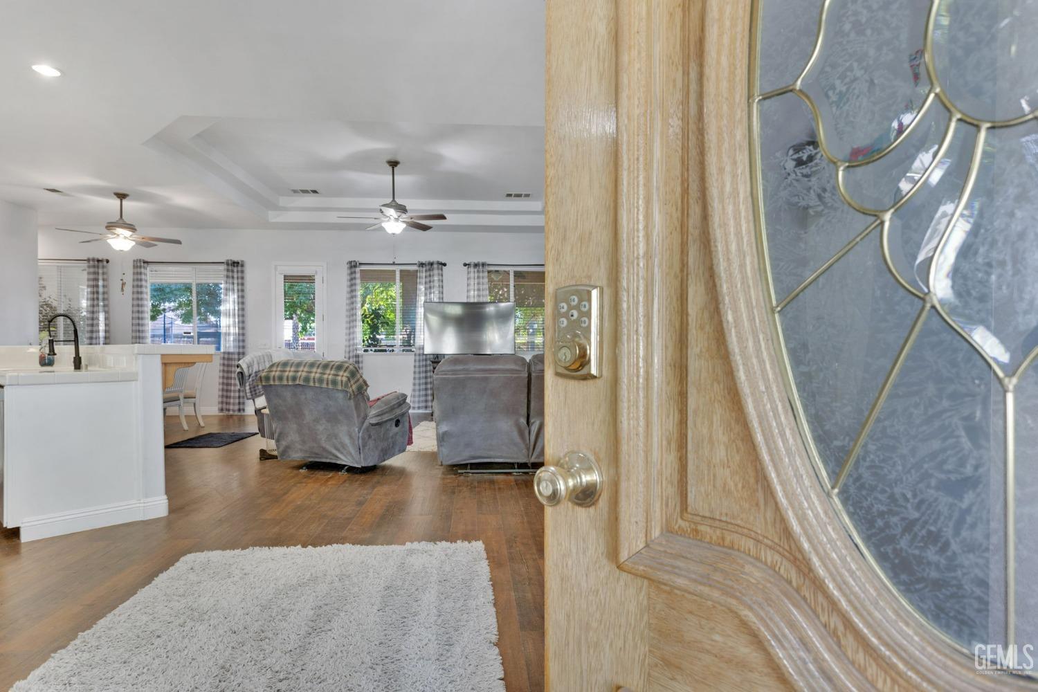 Undisclosed Address Bakersfield, CA 93314 - Photo 4 of 36 a living room with furniture and a chandelier