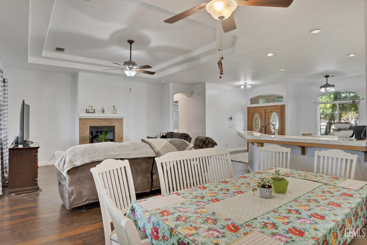 Undisclosed Address Bakersfield, CA 93314 - Photo 8 of 36 a bedroom with a bed and a chandelier