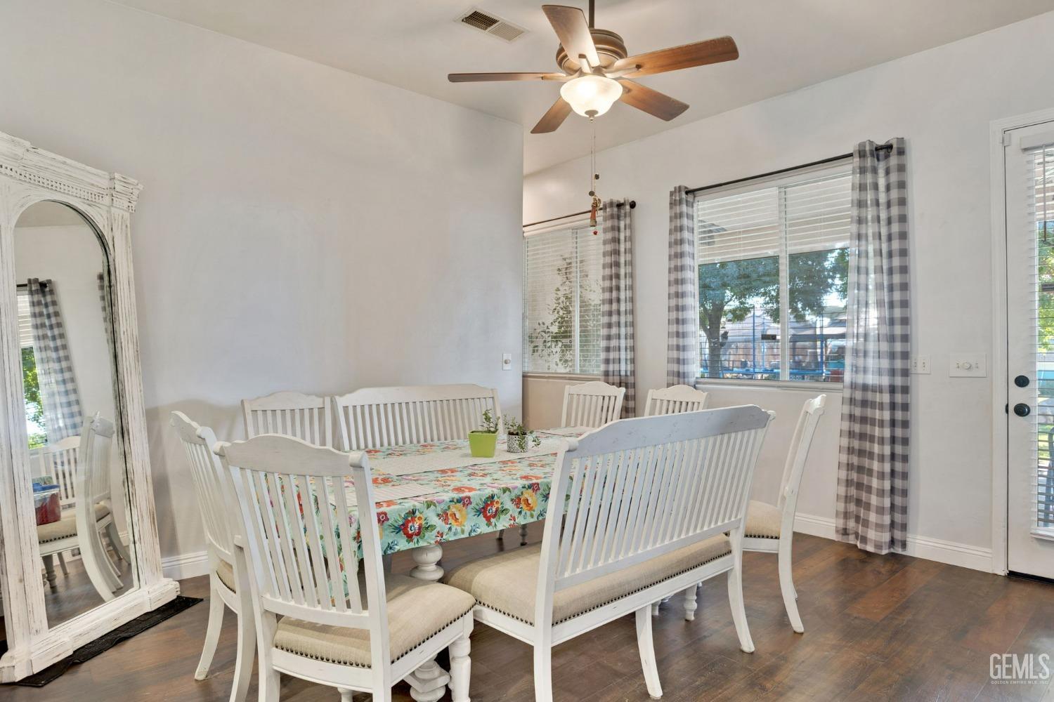Undisclosed Address Bakersfield, CA 93314 - Photo 9 of 36 a view of a dining room with furniture window and wooden floor