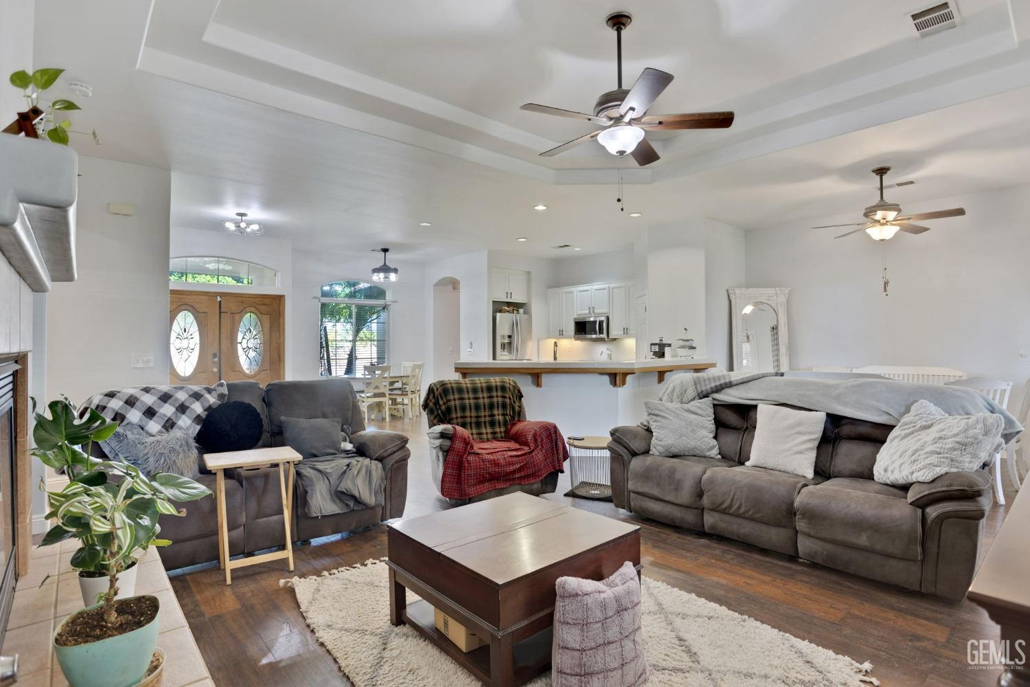 Undisclosed Address Bakersfield, CA 93314 - Photo 10 of 36 a living room with furniture and a chandelier