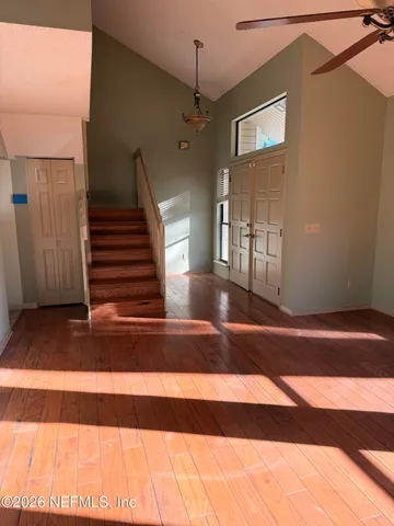 a view of a hallway with a chandelier