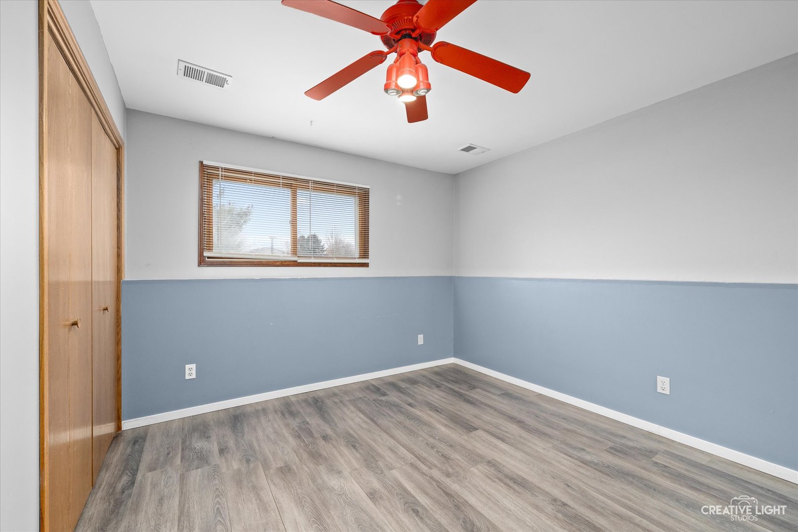 110 Windward Lane Rochelle, IL 61068 - Photo 13 of 23 wooden floor in an empty room with a window