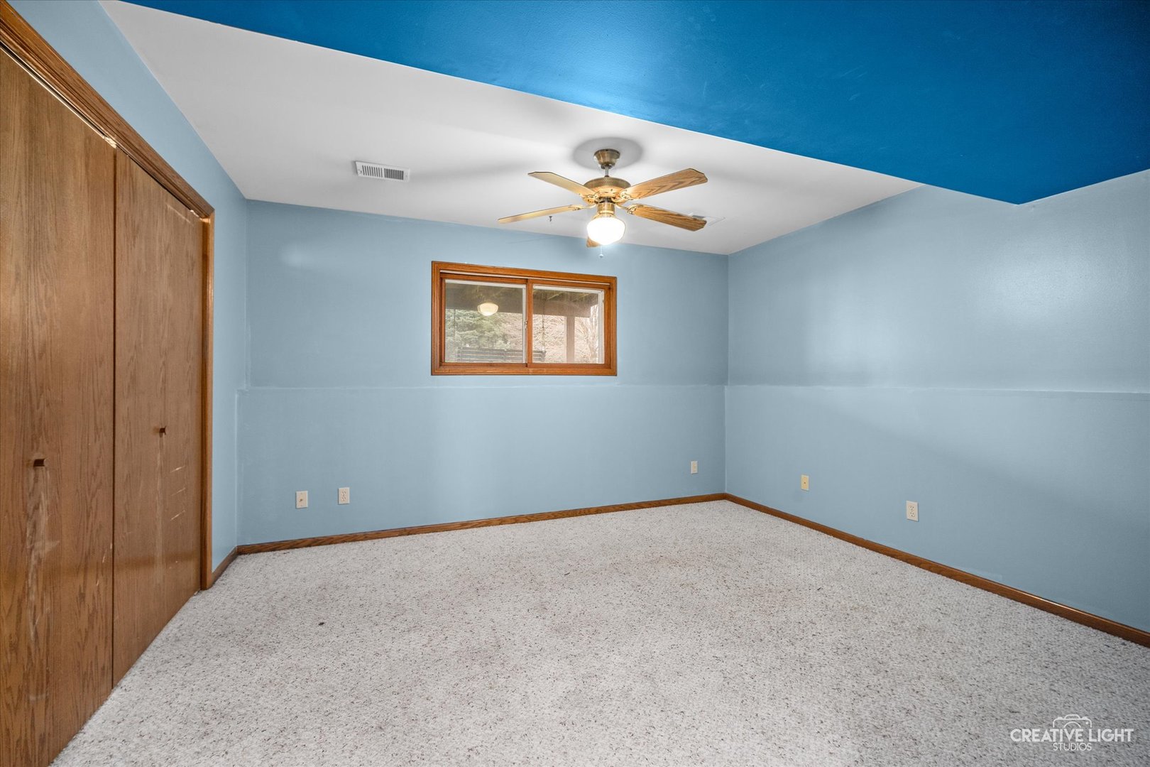 110 Windward Lane Rochelle, IL 61068 - Photo 17 of 23 an empty room with windows and fan