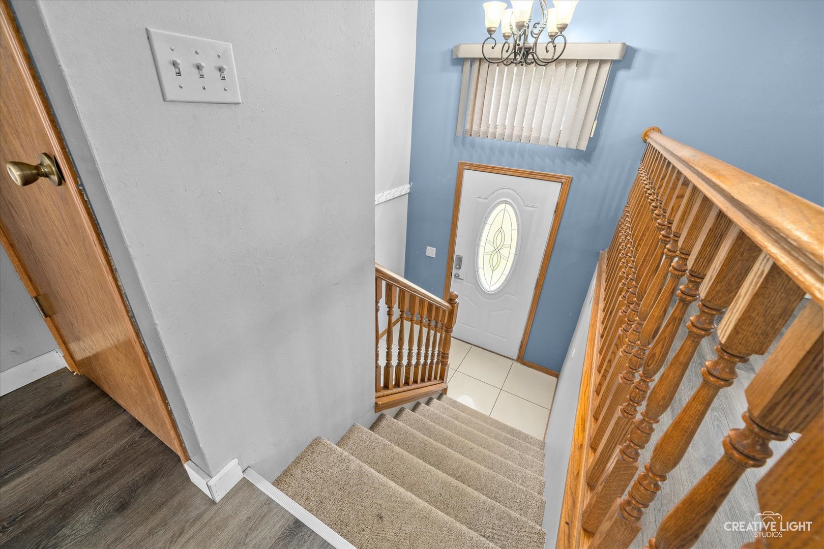 110 Windward Lane Rochelle, IL 61068 - Photo 2 of 23 a view of a hallway with wooden floor and staircase