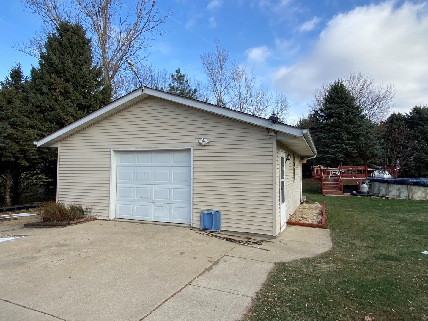 110 Windward Lane Rochelle, IL 61068 - Photo 23 of 23 a view of a white house with a yard and garage