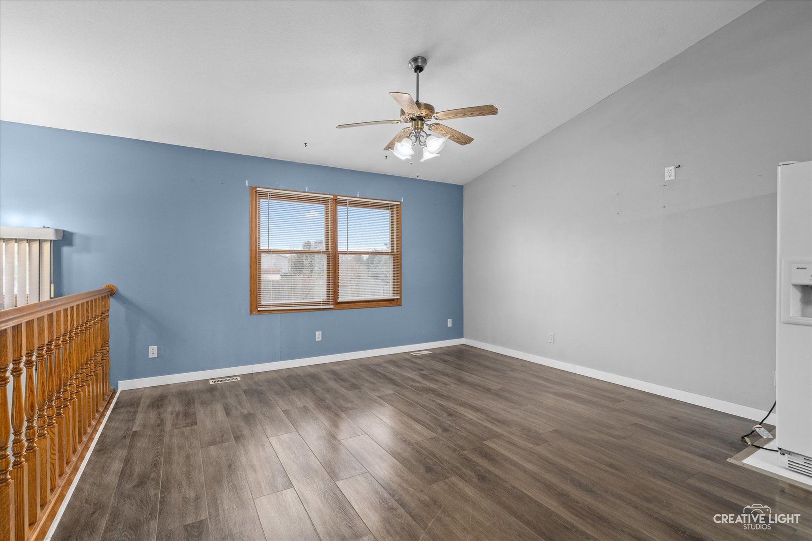 110 Windward Lane Rochelle, IL 61068 - Photo 3 of 23 wooden floor in an empty room with a window