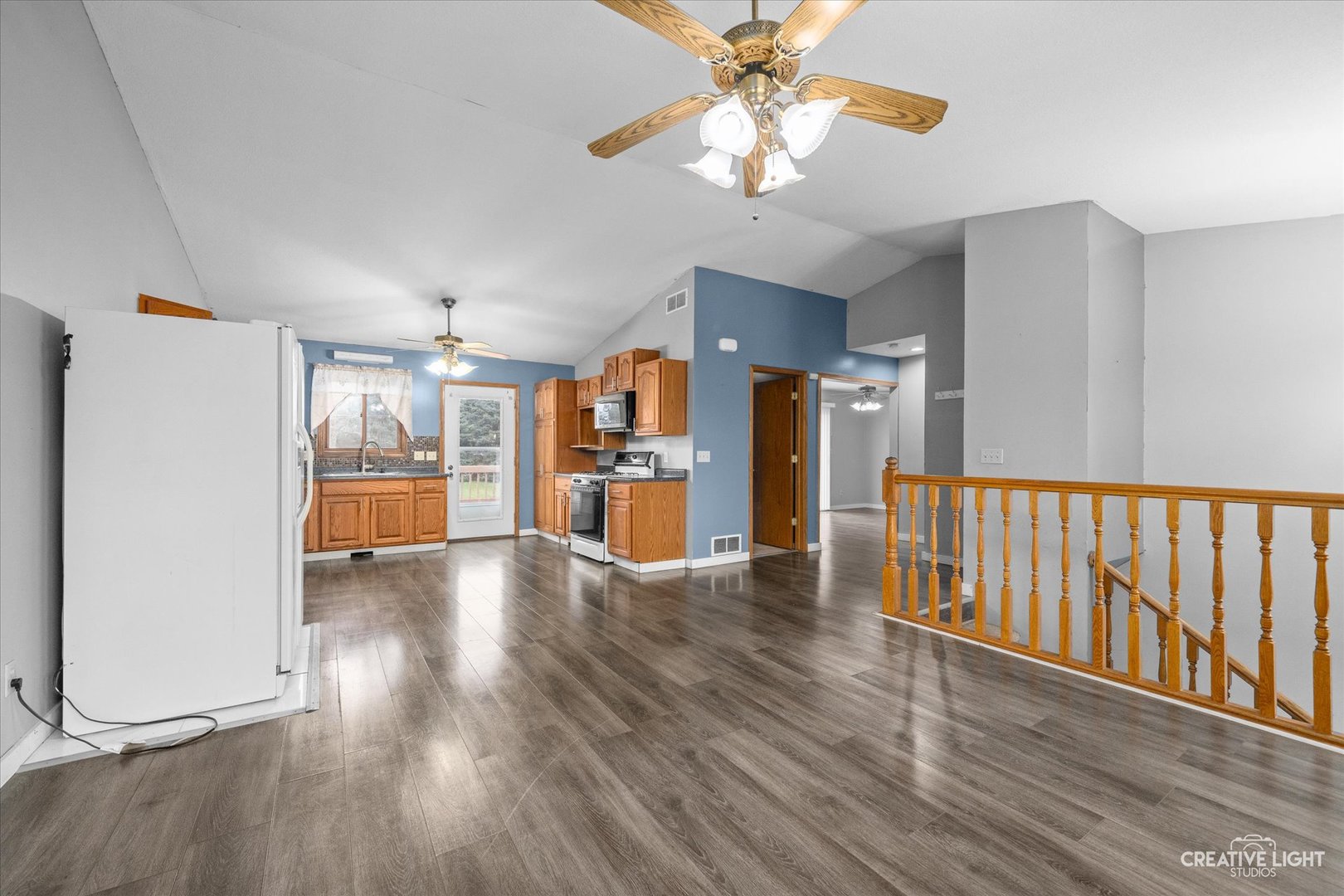 110 Windward Lane Rochelle, IL 61068 - Photo 4 of 23 a view of an empty room with a window and wooden floor