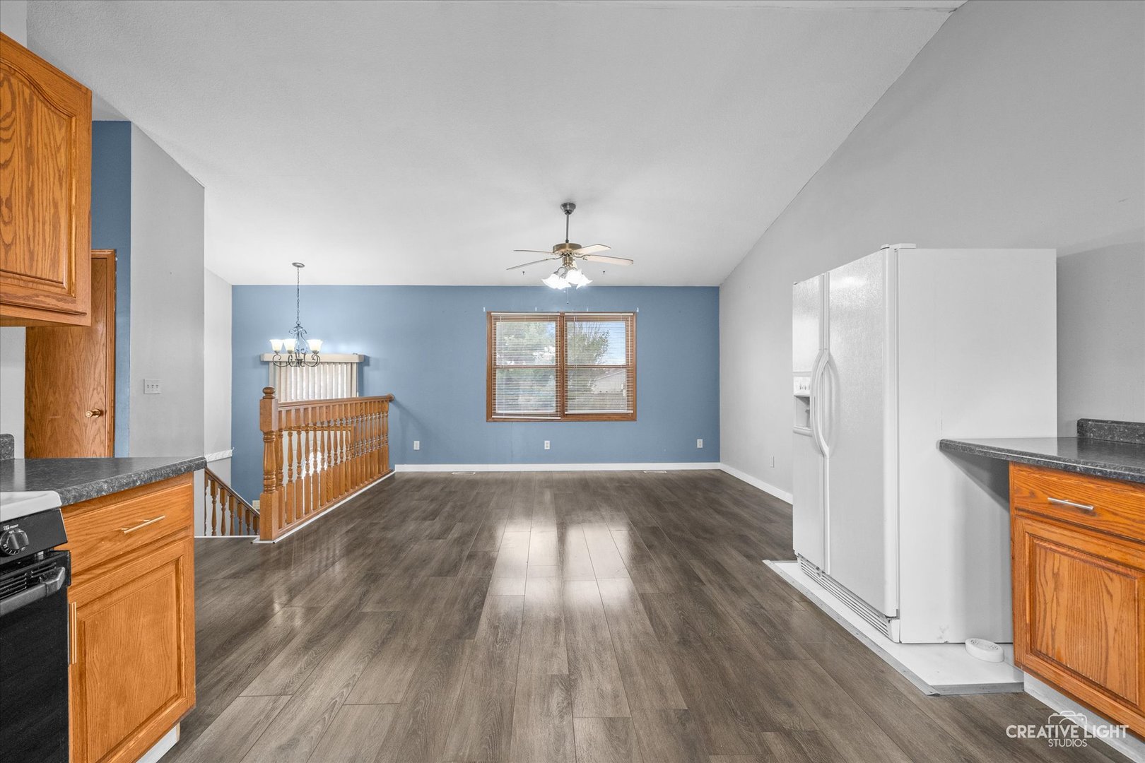 110 Windward Lane Rochelle, IL 61068 - Photo 7 of 23 a view of an empty room with window and wooden floor