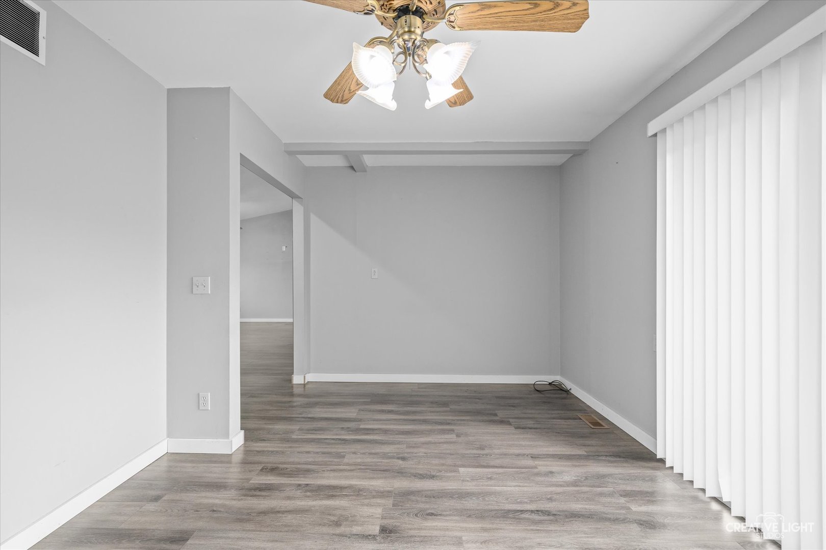 110 Windward Lane Rochelle, IL 61068 - Photo 10 of 23 a view of empty room with wooden floor and fan