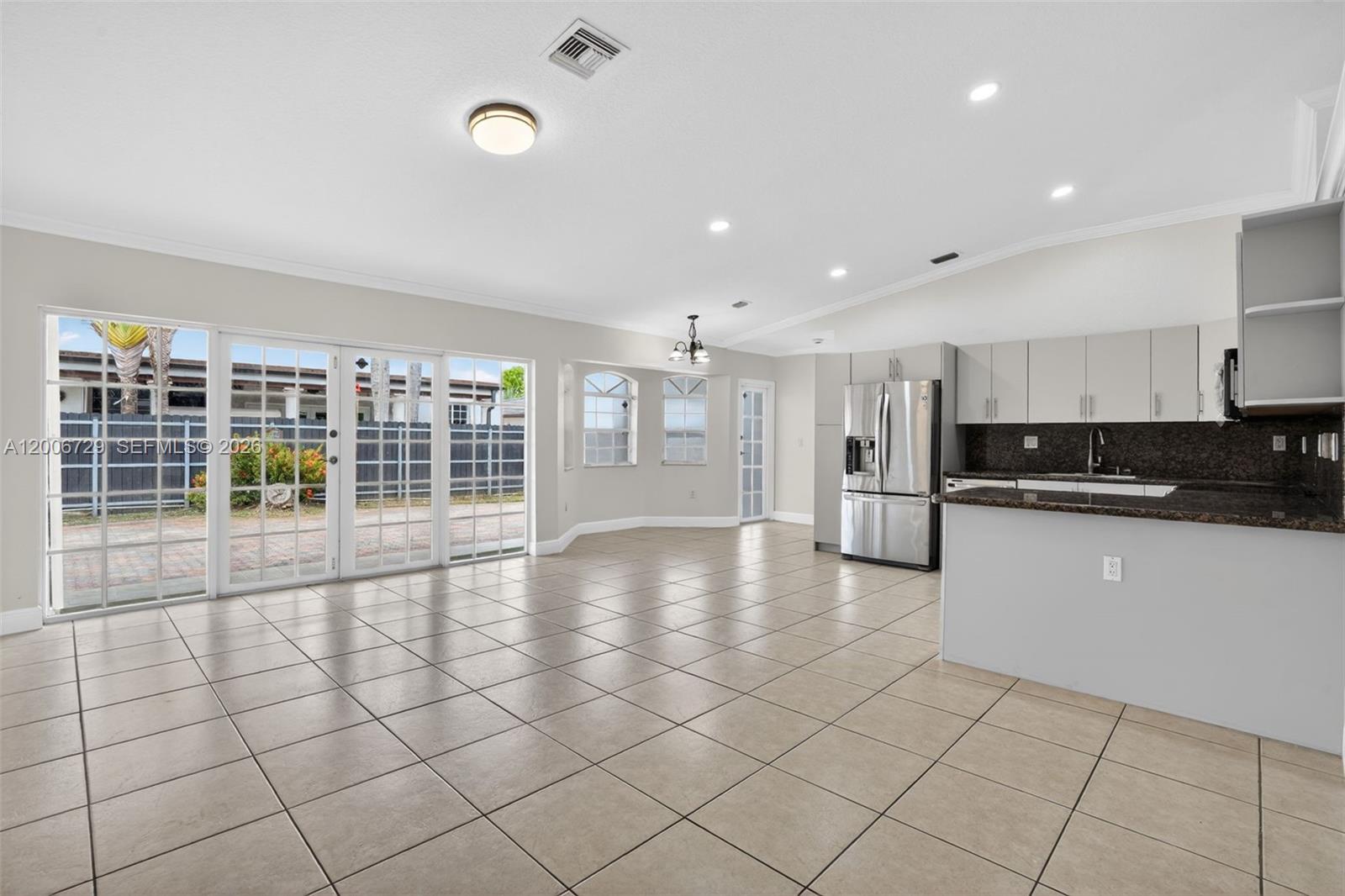 14251 Southwest 34th Street Miami, FL 33175 - Photo 11 of 54 a view of an empty room with a kitchen