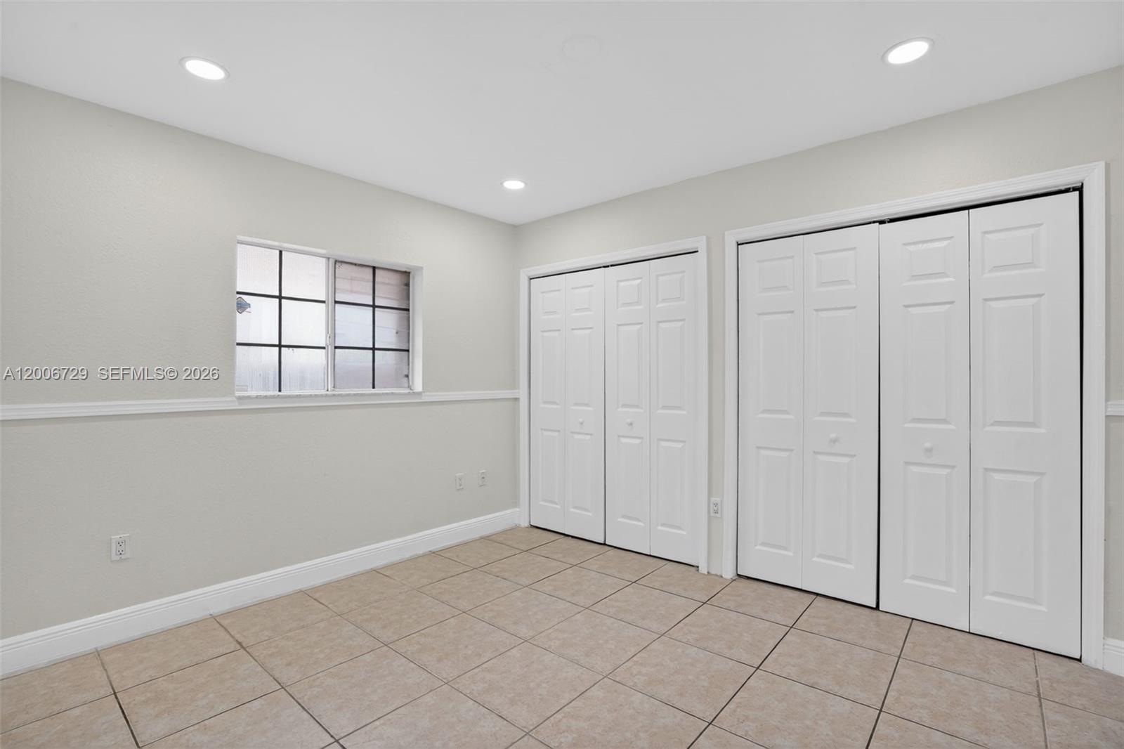 14251 Southwest 34th Street Miami, FL 33175 - Photo 20 of 54 a view of an empty room with window