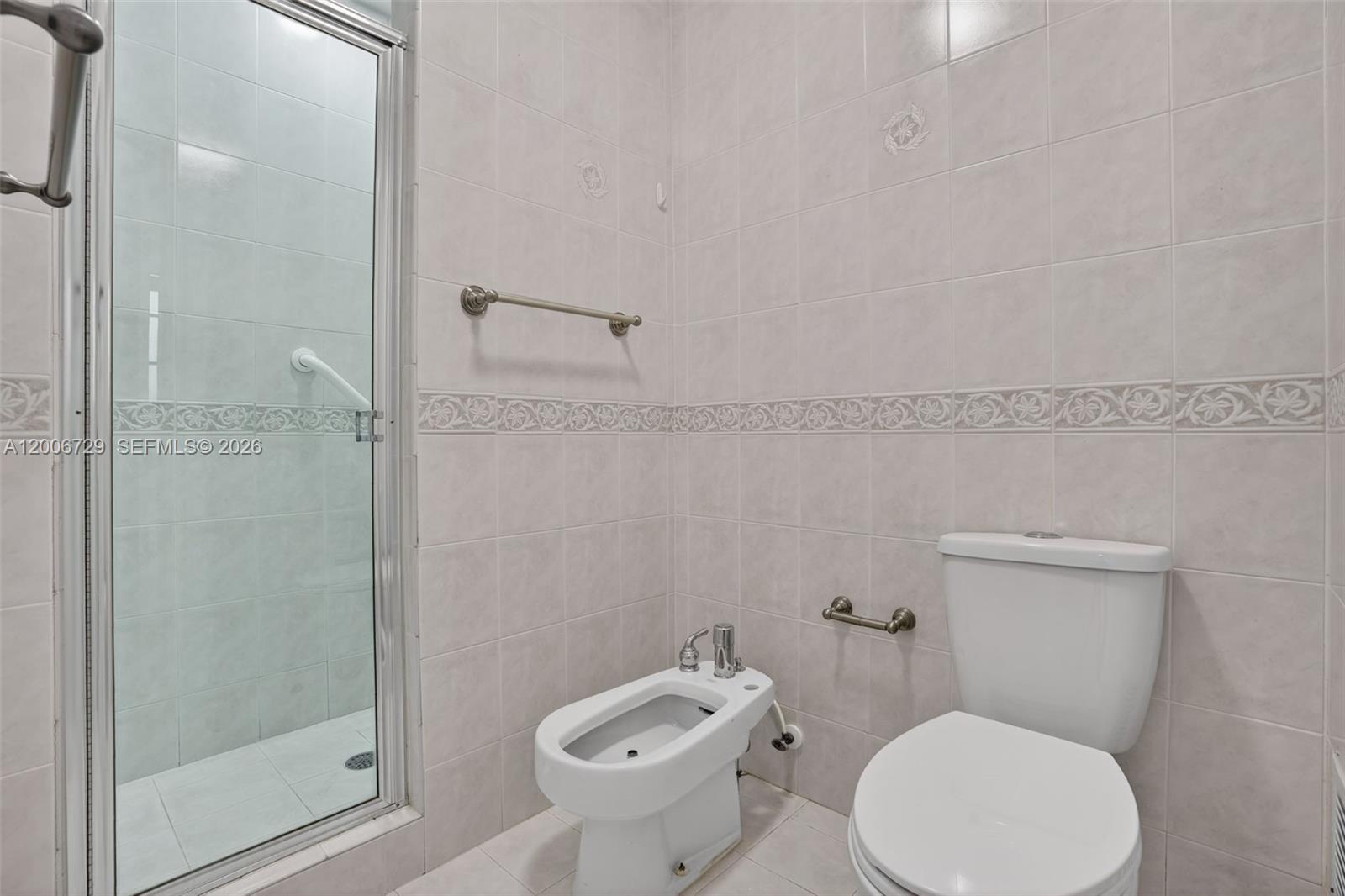 14251 Southwest 34th Street Miami, FL 33175 - Photo 29 of 54 a white toilet sitting next to a bathroom sink
