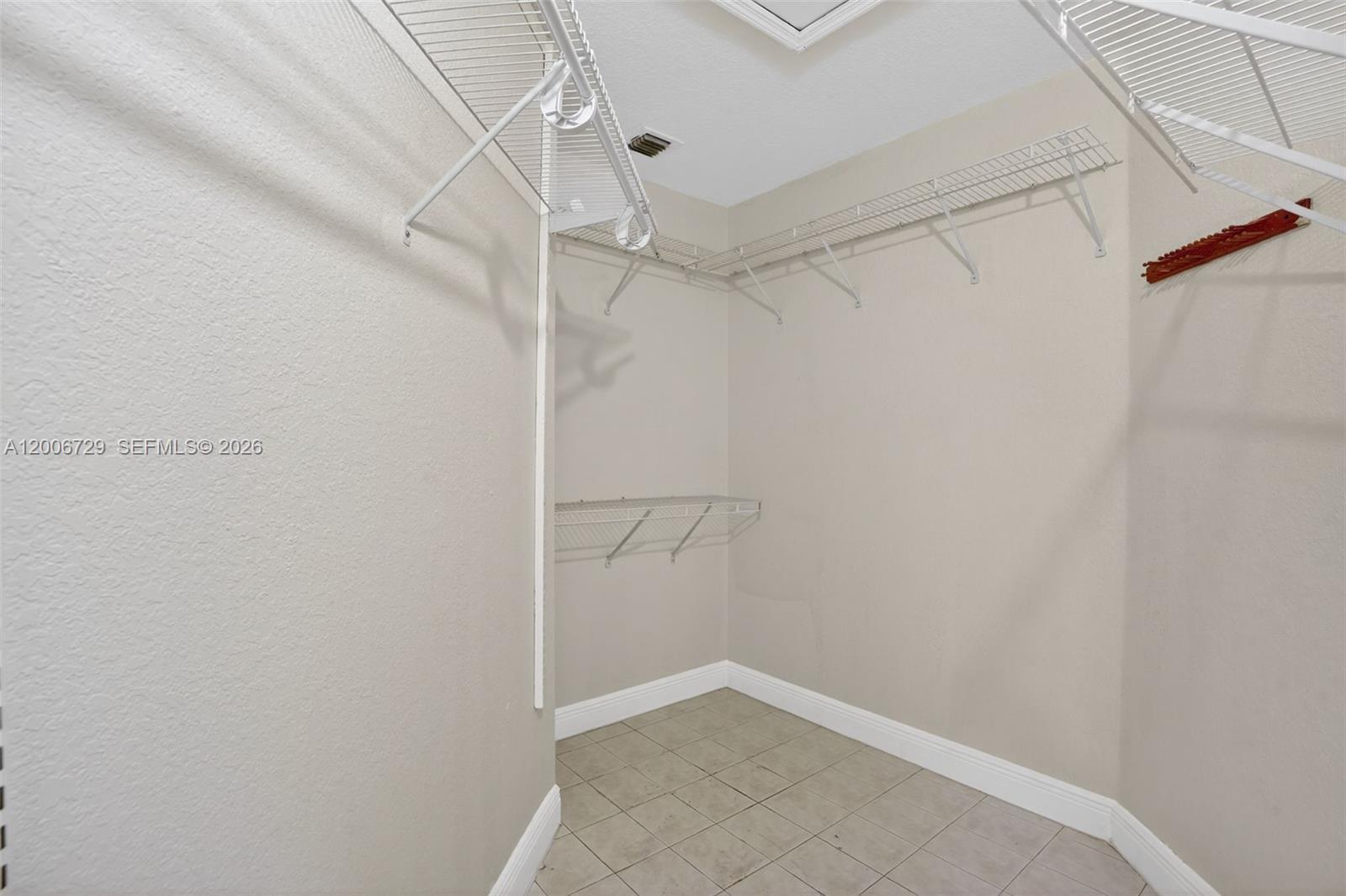14251 Southwest 34th Street Miami, FL 33175 - Photo 30 of 54 a view of a room with racks on the wall