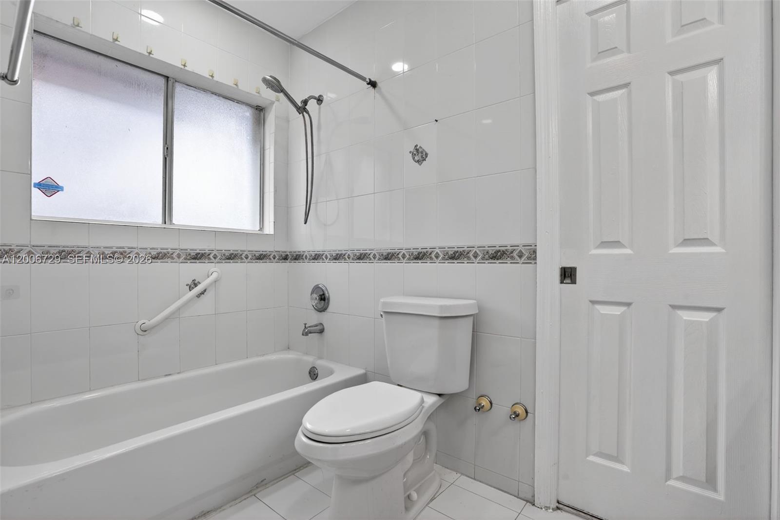 14251 Southwest 34th Street Miami, FL 33175 - Photo 36 of 54 a bathroom with a granite countertop toilet a sink and a bathtub