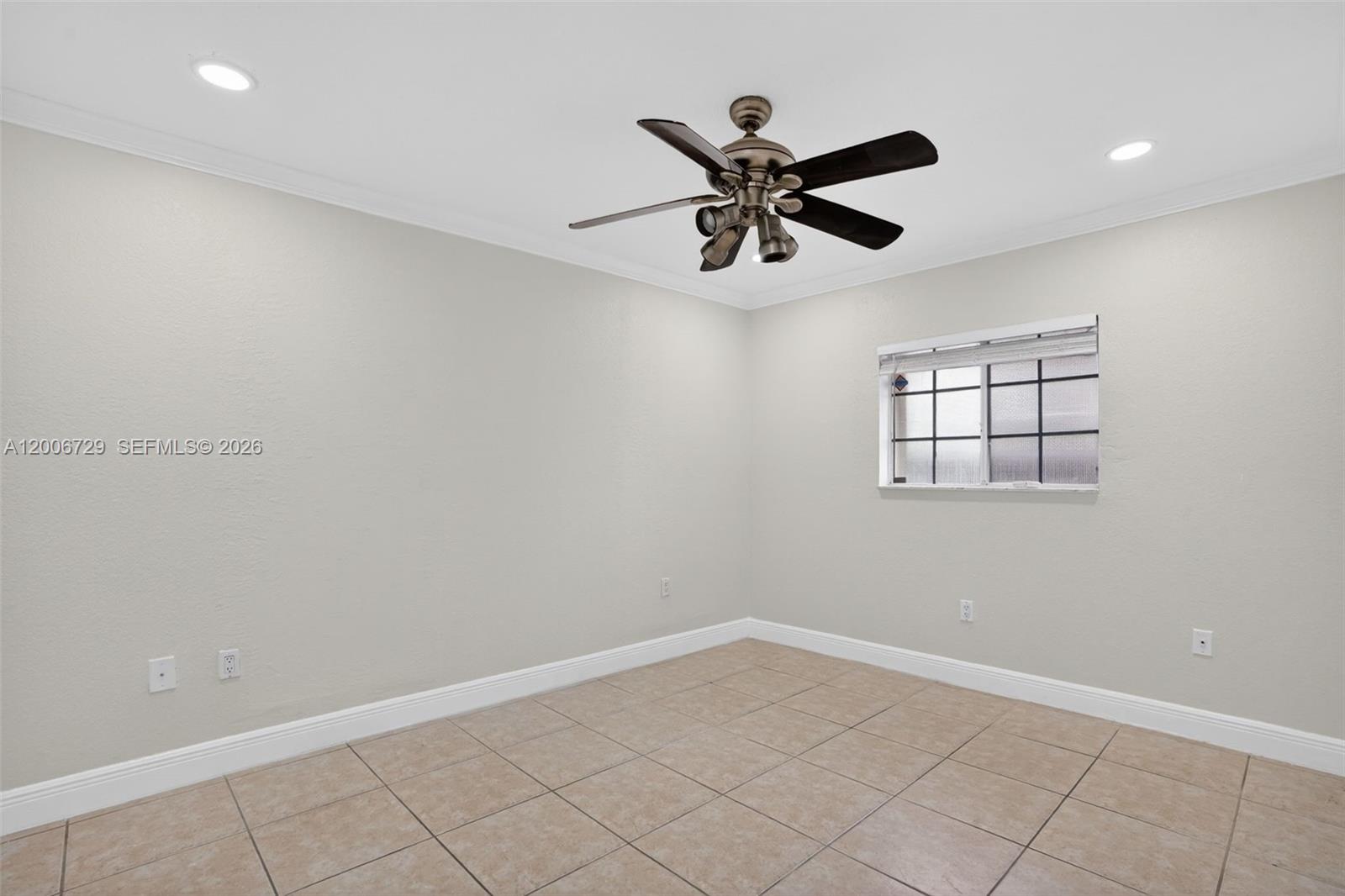 14251 Southwest 34th Street Miami, FL 33175 - Photo 37 of 54 a view of a big room with wooden floor and windows