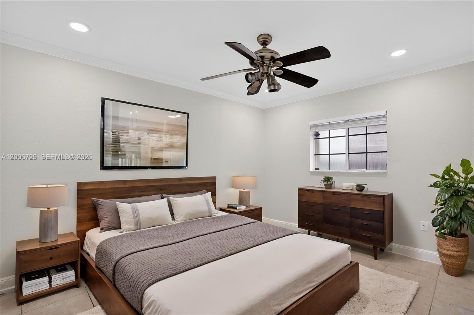 14251 Southwest 34th Street Miami, FL 33175 - Photo 38 of 54 a bedroom with a large bed and a window