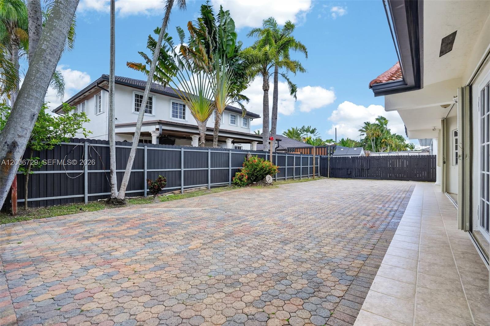 14251 Southwest 34th Street Miami, FL 33175 - Photo 44 of 54 a view of a yard with wooden fence