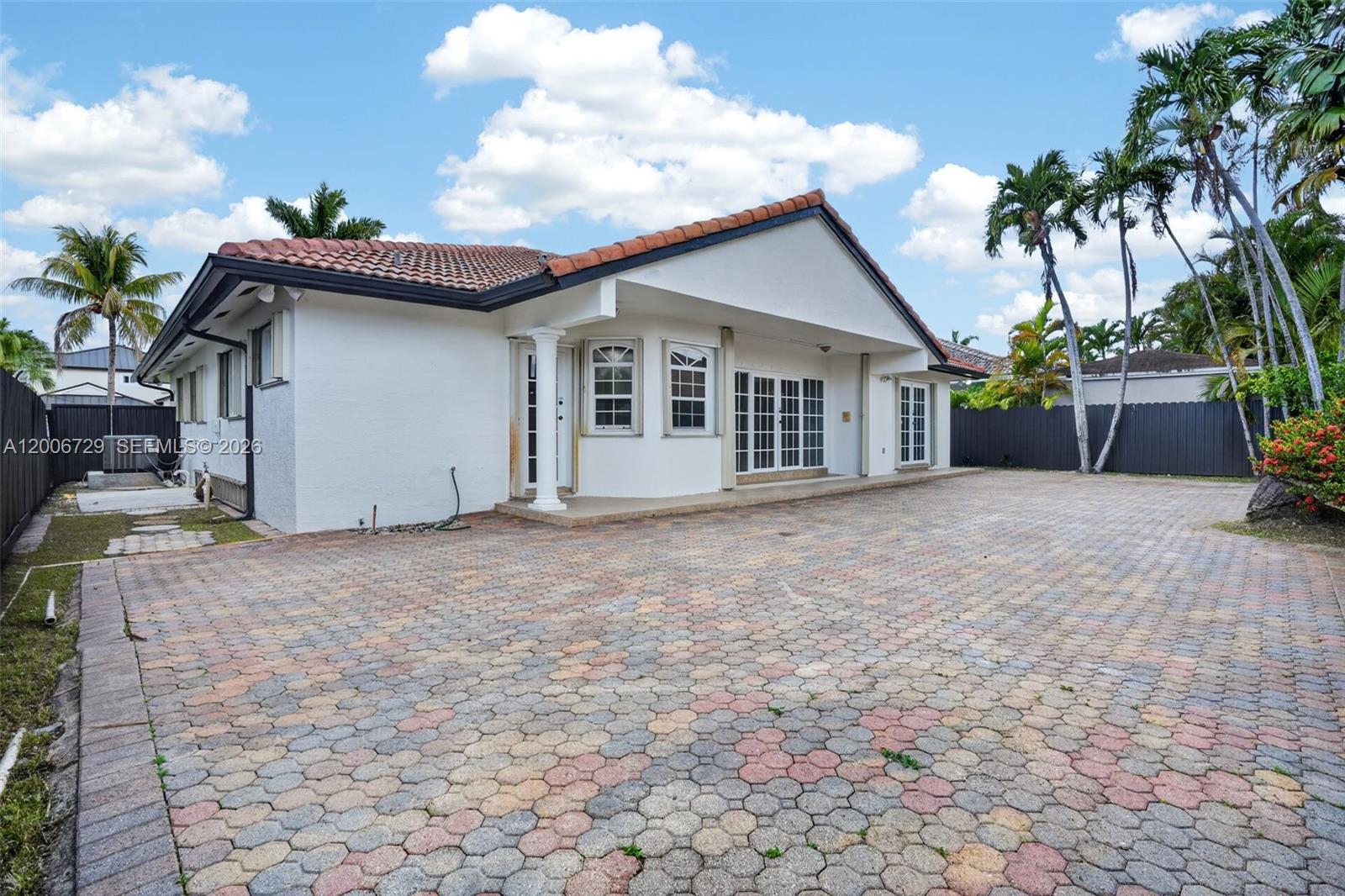 14251 Southwest 34th Street Miami, FL 33175 - Photo 46 of 54 a view of a house with a yard and potted plants