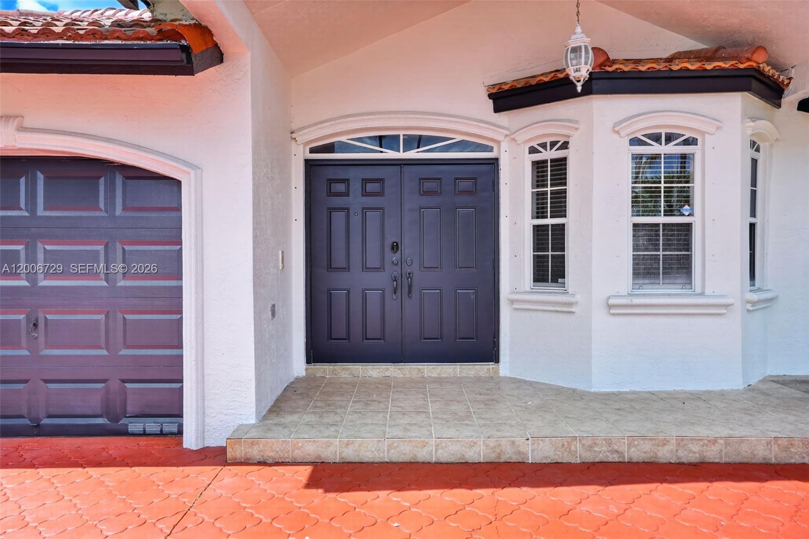 14251 Southwest 34th Street Miami, FL 33175 - Photo 5 of 54 a front view of a house with a yard