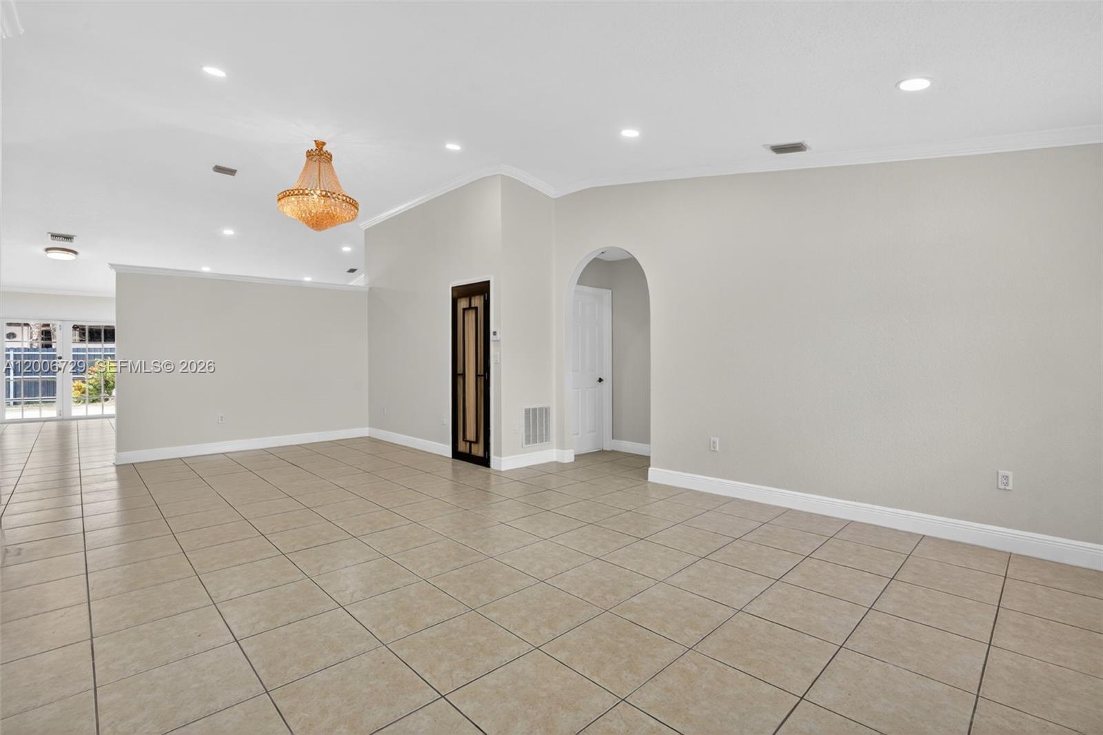 14251 Southwest 34th Street Miami, FL 33175 - Photo 6 of 54 an empty room with a outdoor space and window