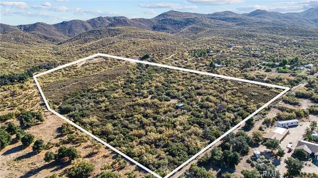 an aerial view of house with yard