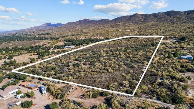 a view of a city with mountains in the background