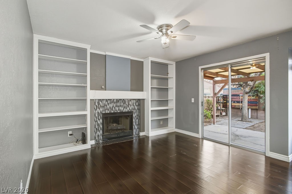 863 Brass Ring Road Las Vegas, NV 89123 - Photo 20 of 47 Family room with built in shelves and gas fireplace