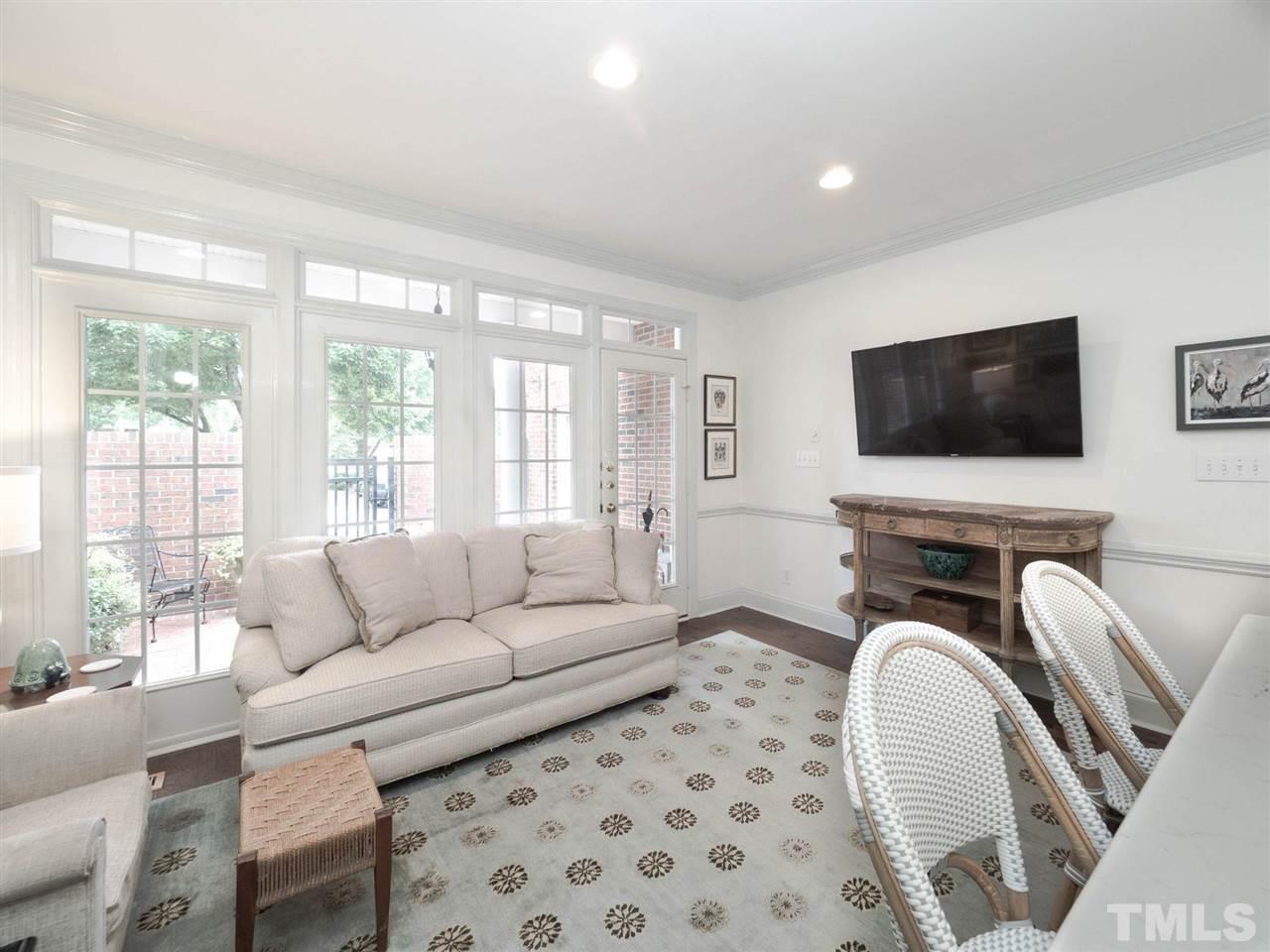 3521 Barron Berkeley Way Raleigh, NC 27612 - Photo 14 of 30 a living room with furniture and a flat screen tv