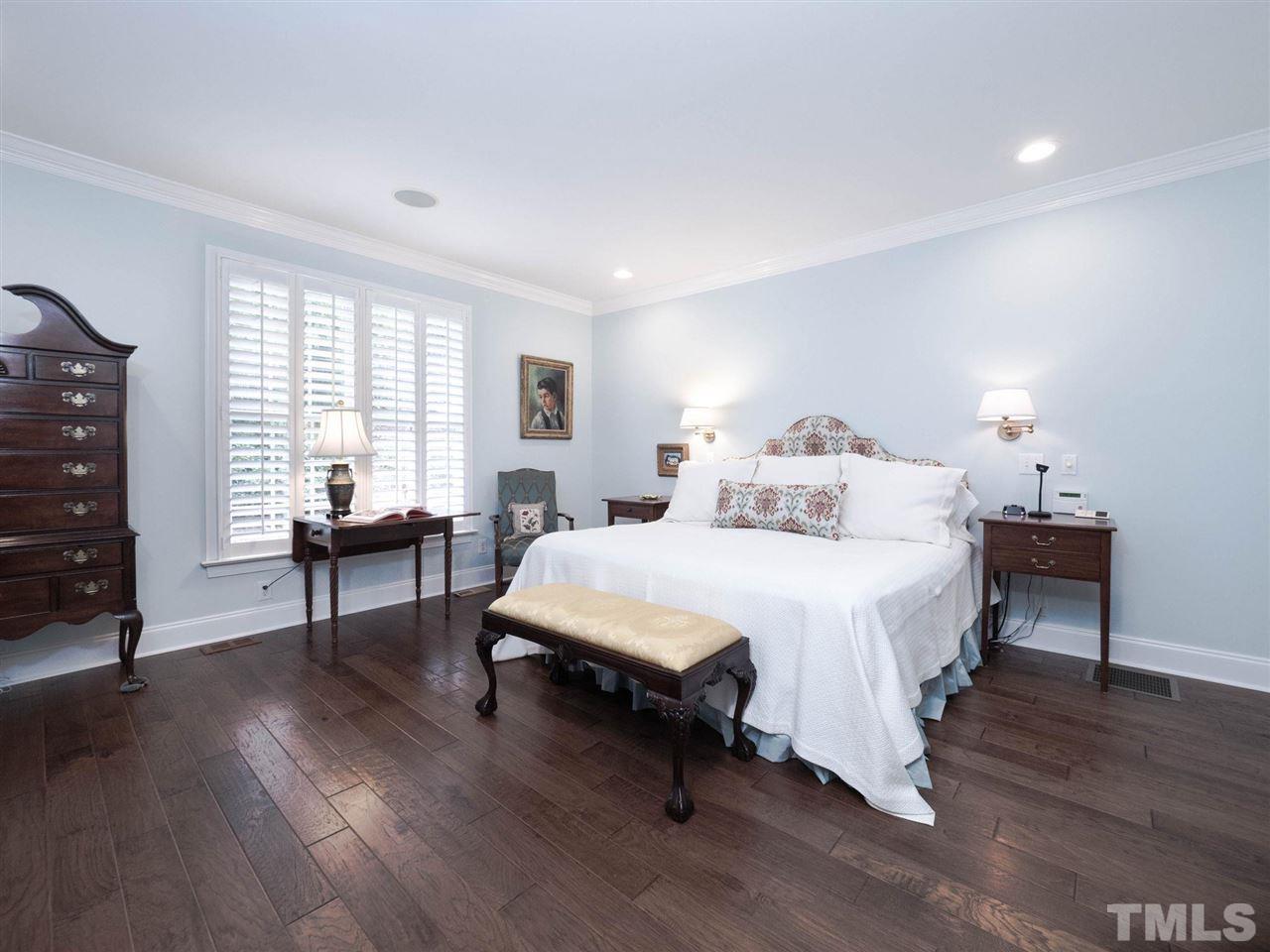 3521 Barron Berkeley Way Raleigh, NC 27612 - Photo 18 of 30 a bedroom with a bed and a couch